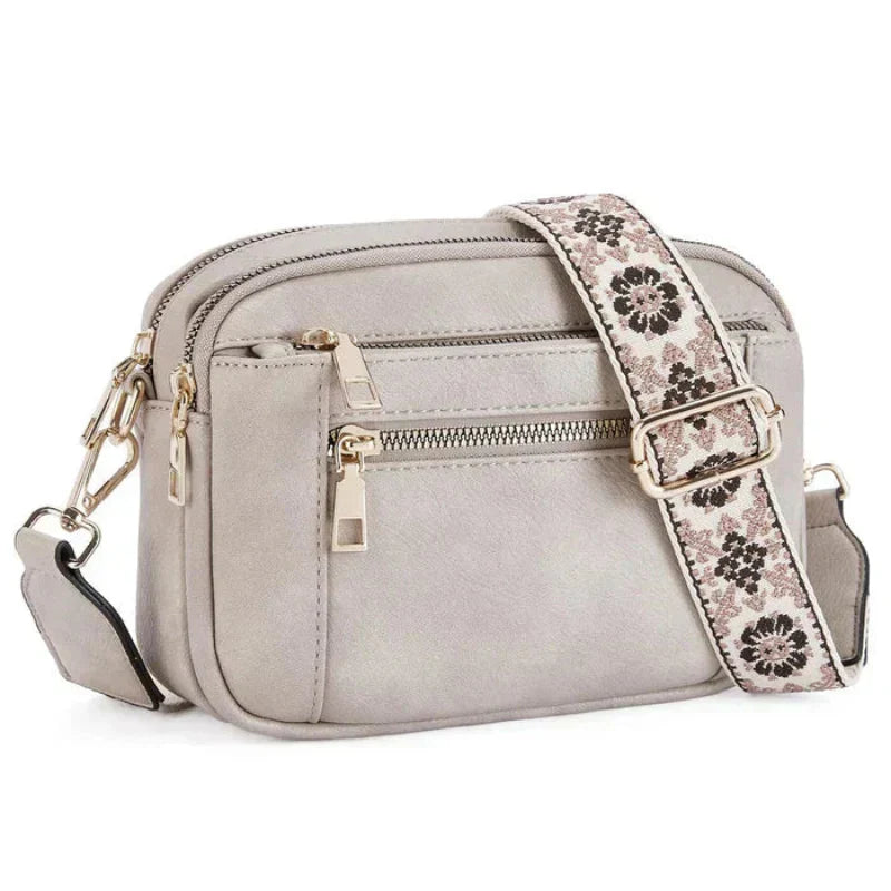 Arvida | Crossbody-veske med trykt stropp