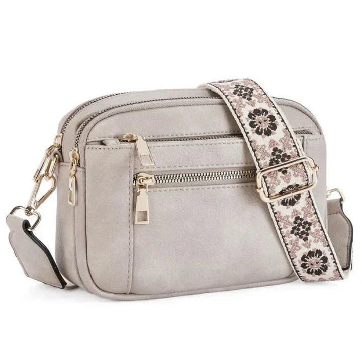 Arvida | Crossbody-veske med trykt stropp